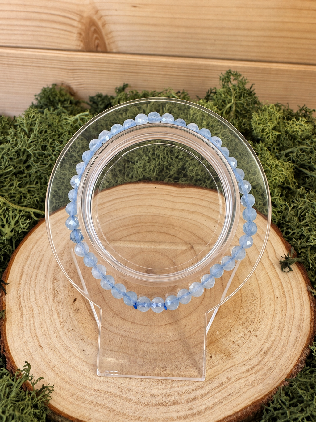 Pale blue faceted Aquamarine bead bracelet displayed on jewellery stand