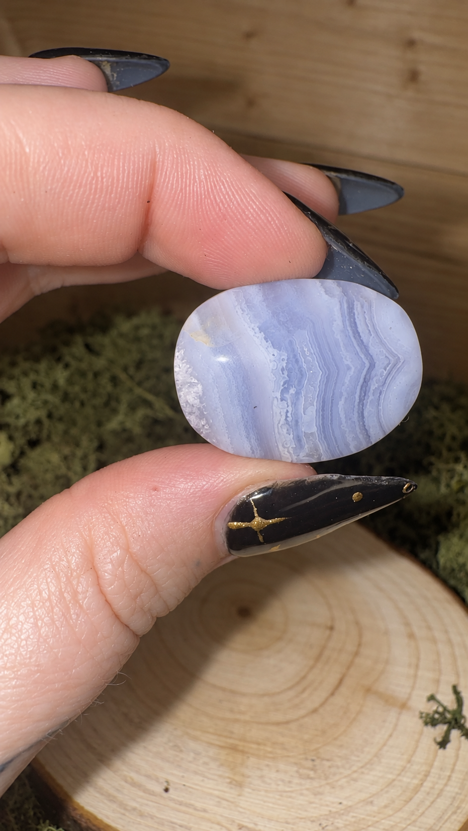 Polished Blue Lace Agate pocket stone showing fine blue and white banded pattern