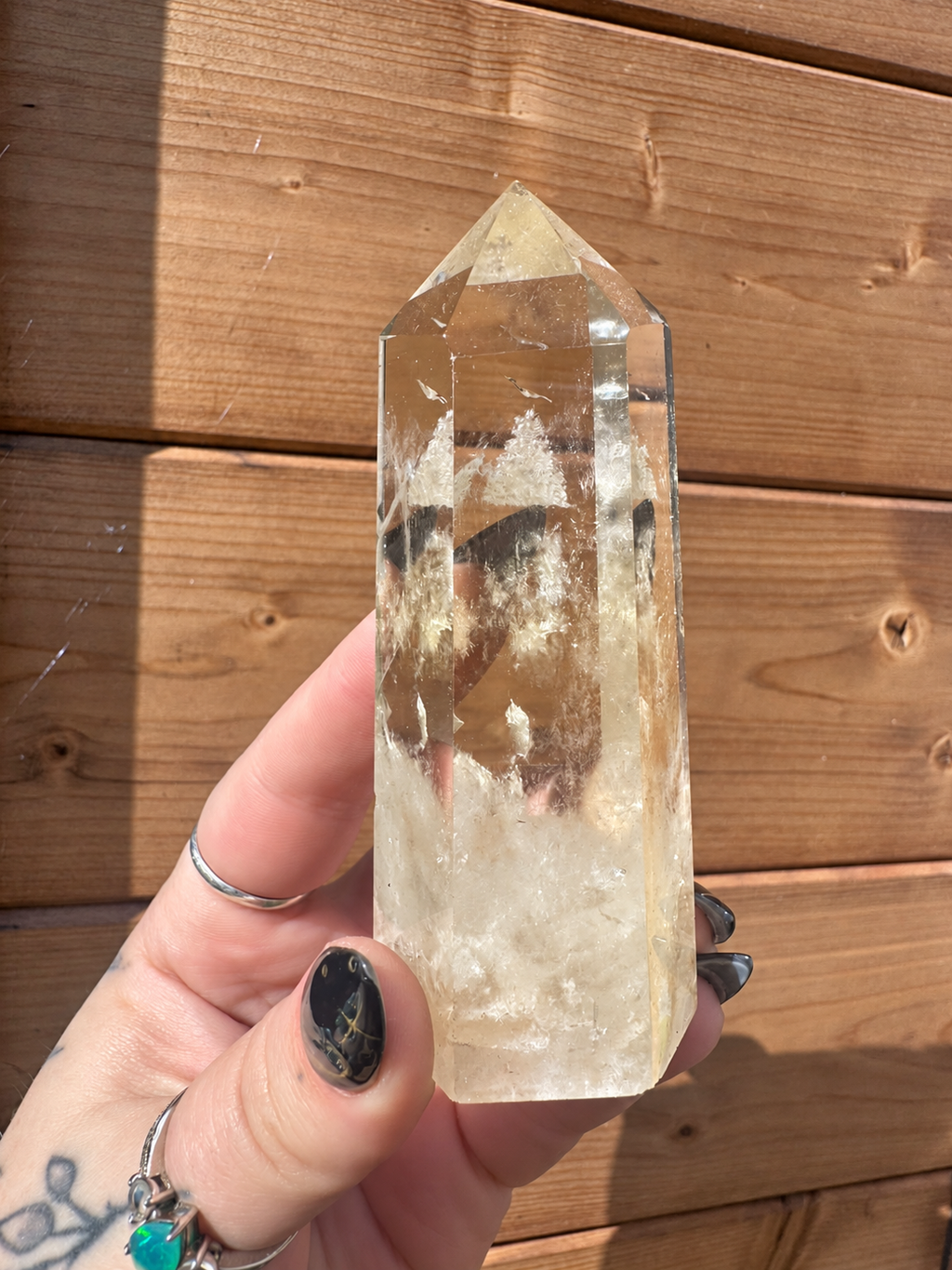 164g Citrine crystal tower from Brazil held in natural sunlight