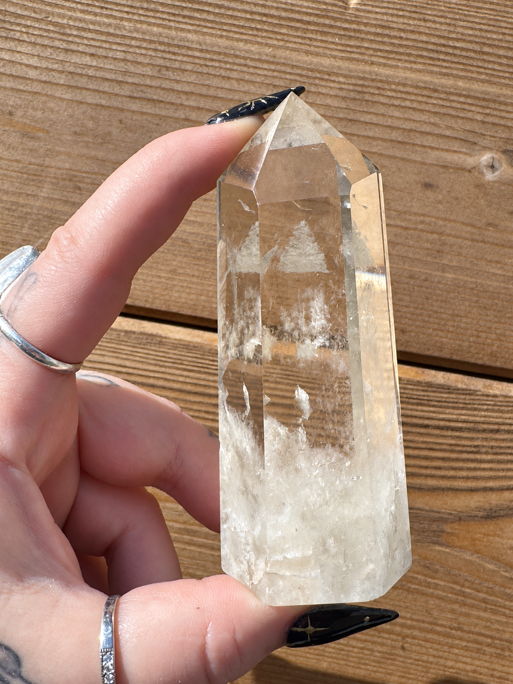 Side view of polished Brazilian Citrine tower showing clarity and internal veils