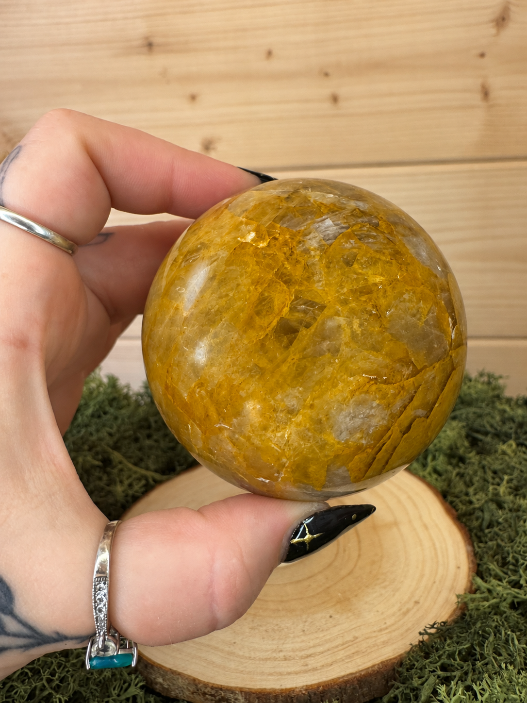 417g Golden Healer Quartz crystal sphere showing golden mineral inclusions