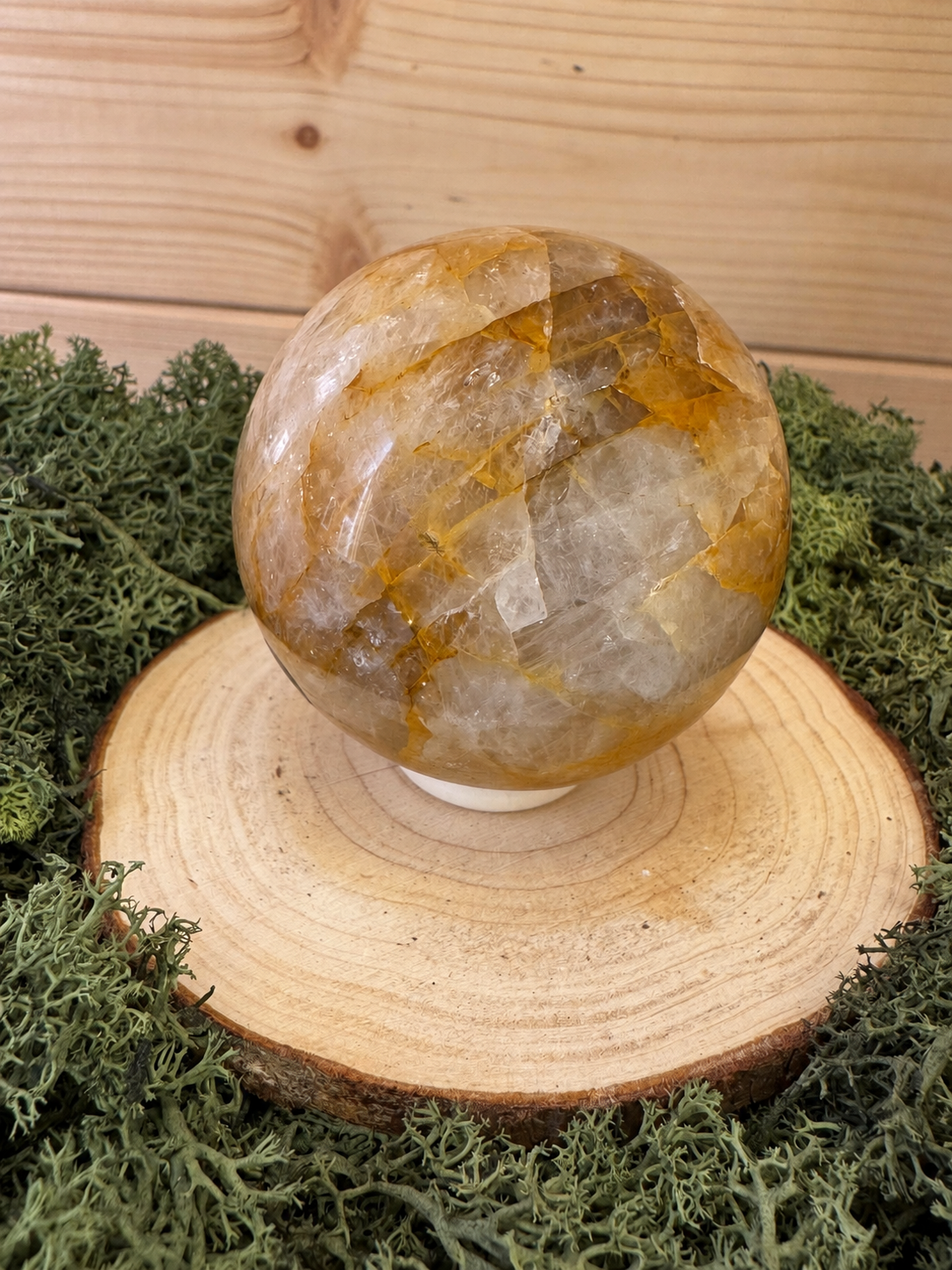 Golden Healer Quartz sphere showing clear quartz and golden iron oxide detail