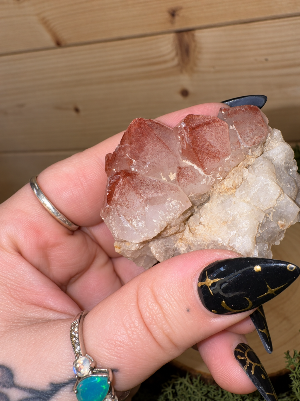 Close-up of Red Phantom Quartz points with rusty red Hematite phantom colouring