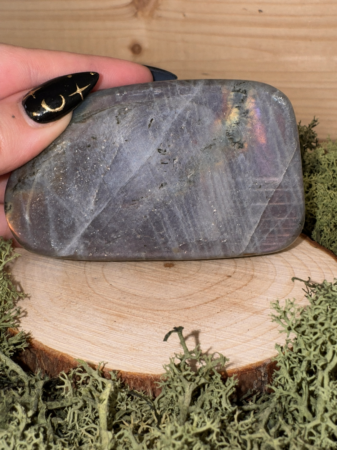 Polished 302g Labradorite freeform showing natural grey reverse and internal structure