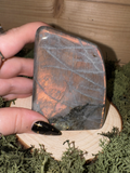 Labradorite freeform D weighing 404g with vivid orange copper and golden flash
