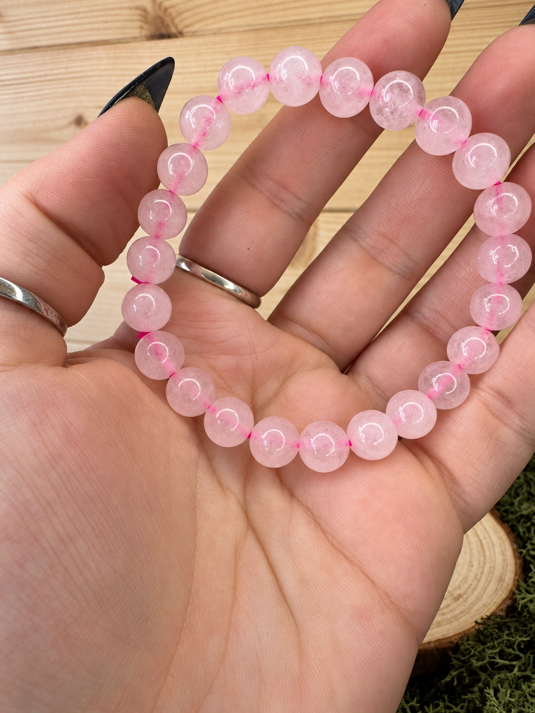 Natural Rose Quartz bead bracelet showing soft pink colouring and translucent polished beads