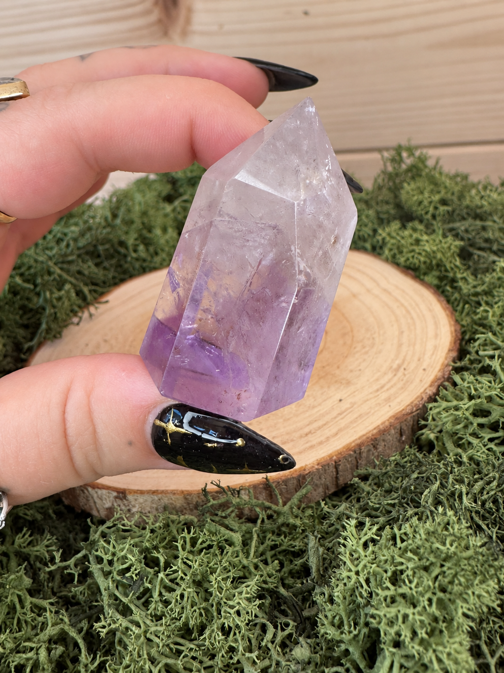 Small polished Amethyst tower showing natural lilac purple colour zoning