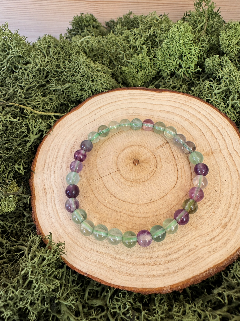 Rainbow Fluorite crystal bead bracelets with translucent green and purple polished beads
