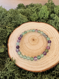 Rainbow Fluorite crystal bead bracelets with translucent green and purple polished beads