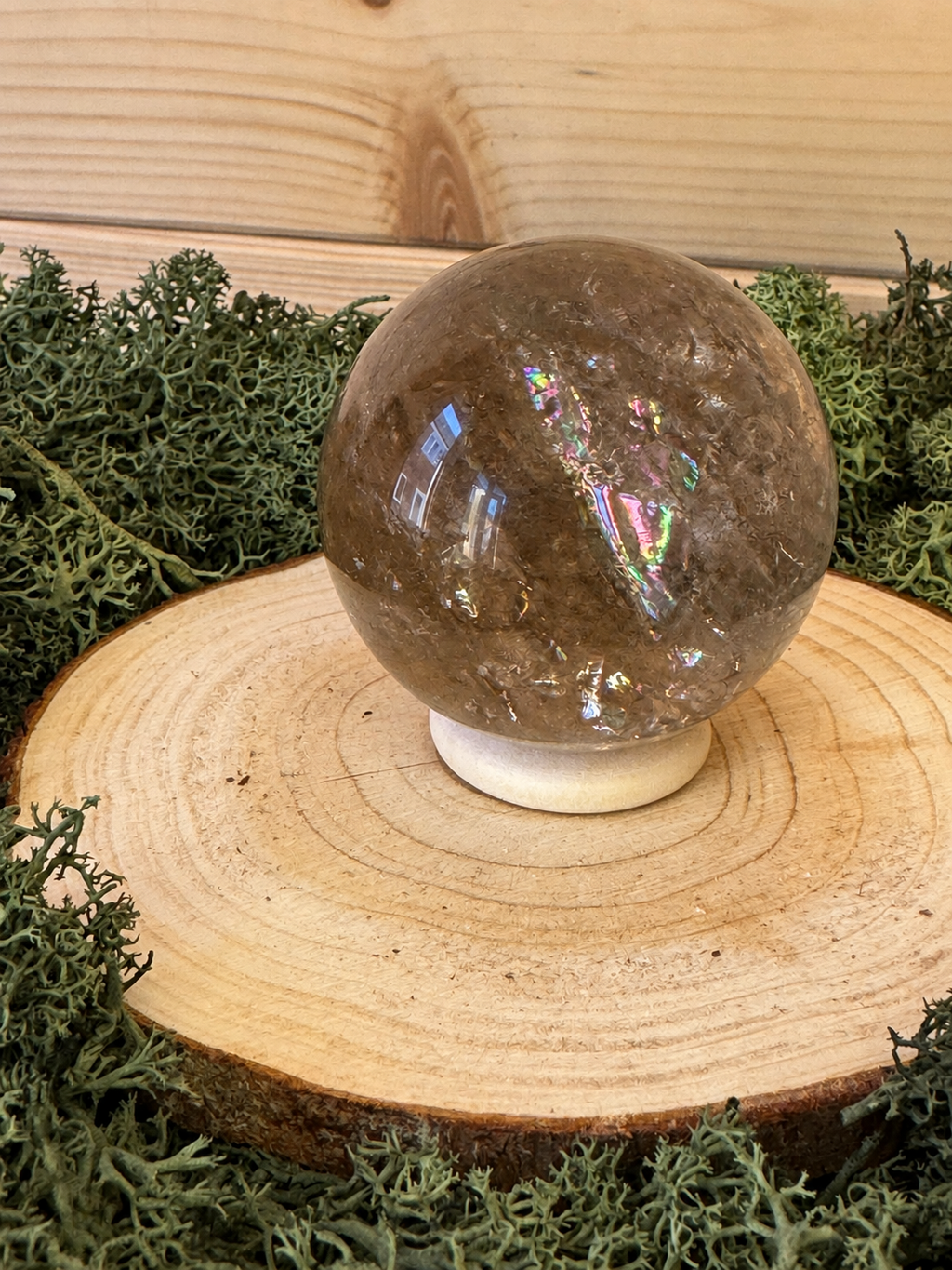 176g natural Smoky Quartz sphere with vivid internal rainbow inclusions