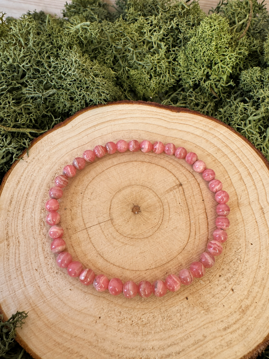 Rhodochrosite crystal bracelet with polished pink and cream banded round beads