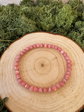 Rhodochrosite crystal bracelet with polished pink and cream banded round beads