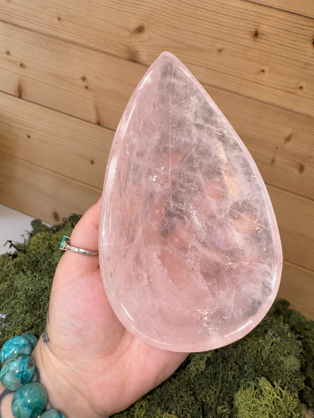 Large Rose Quartz teardrop bowl held in hand showing 511g size and clarity