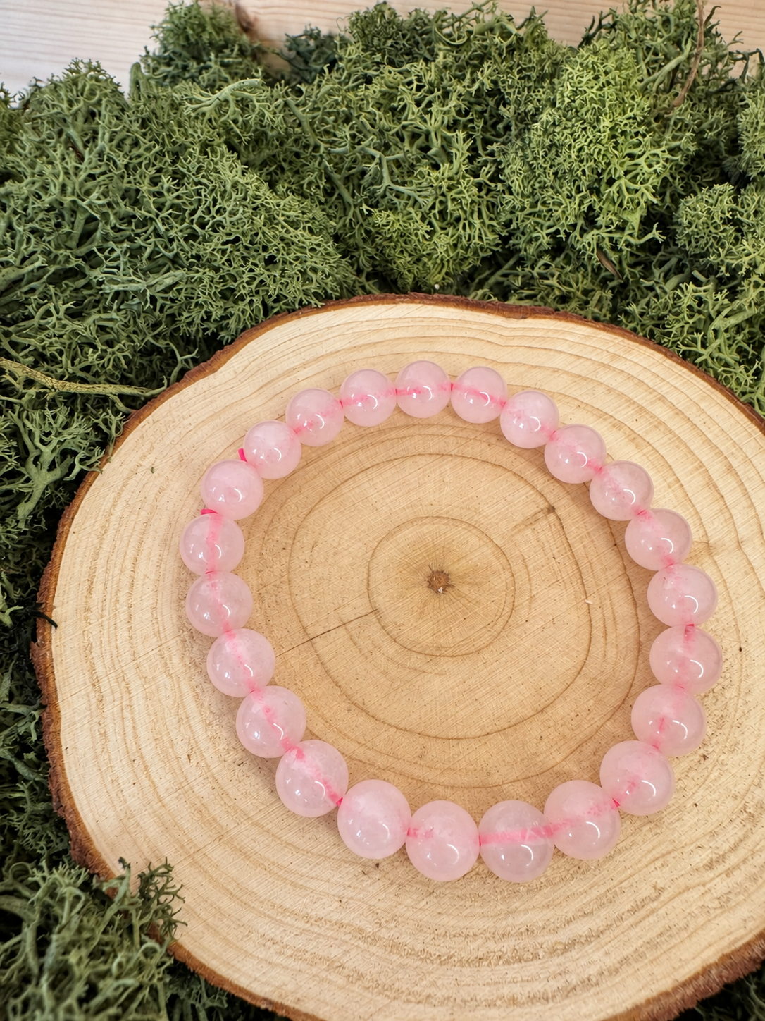 Rose Quartz crystal bracelet with polished translucent pale pink round beads