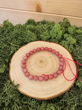 Sakura Rhodonite crystal bracelet with polished deep pink round beads