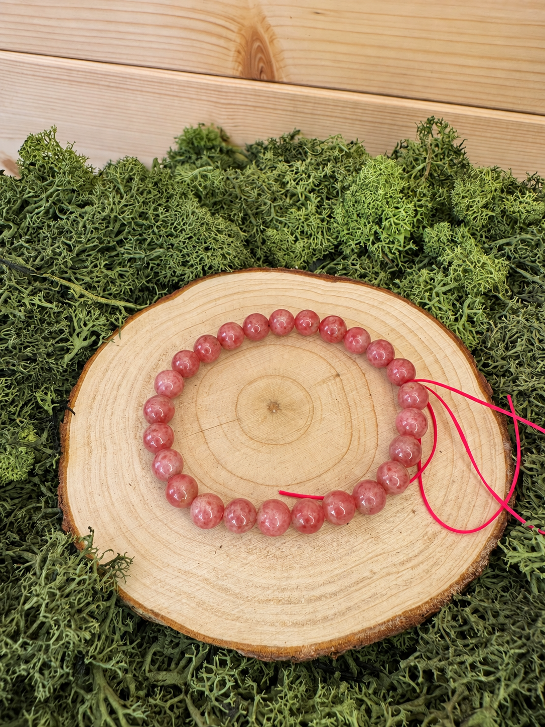 Sakura Rhodonite crystal bracelet with polished deep pink round beads