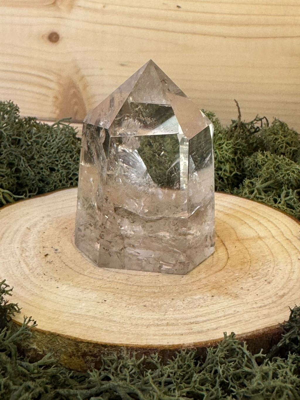 Polished 106g Smoky Quartz crystal point with transparent upper section