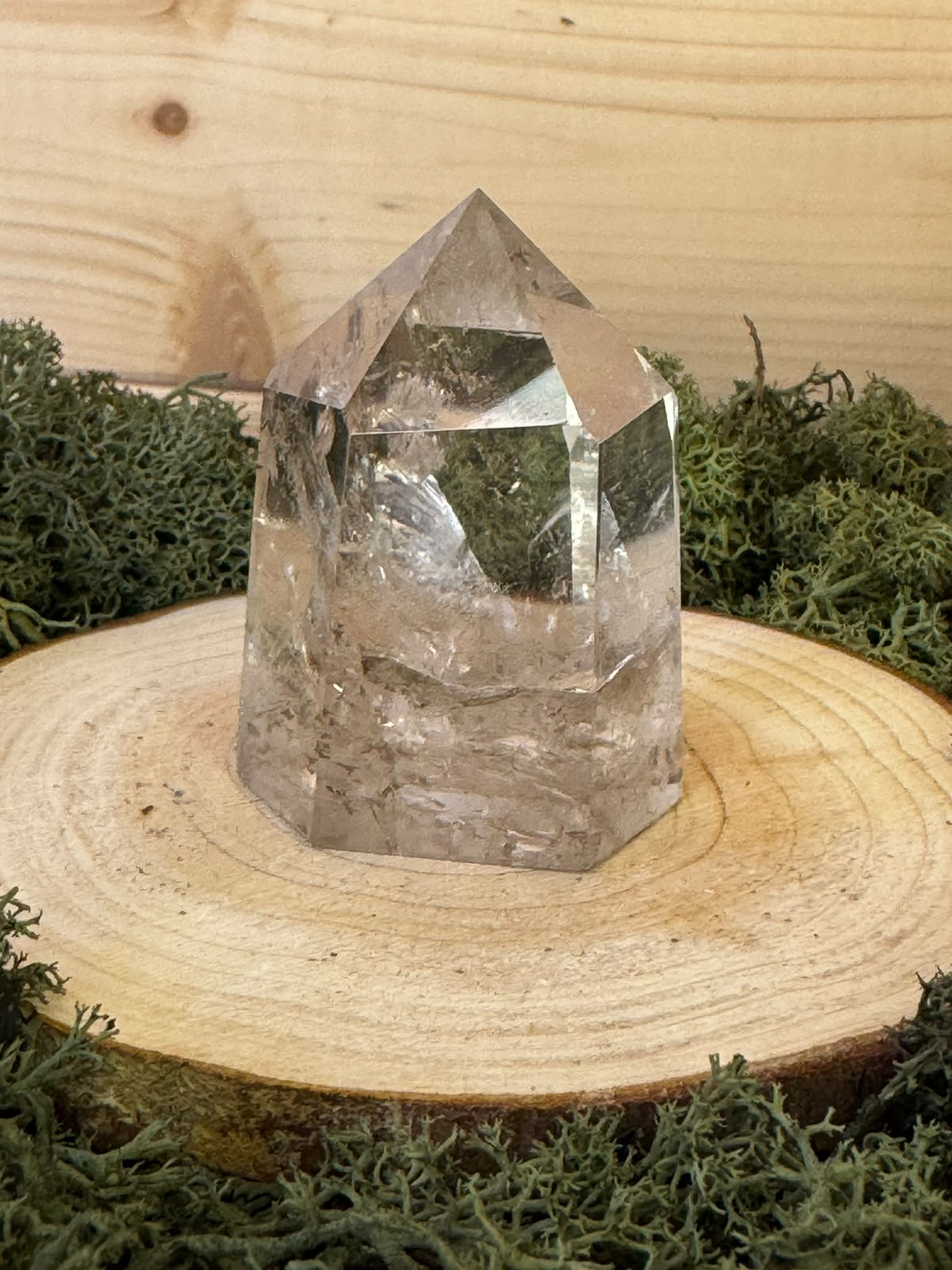 Polished 106g Smoky Quartz crystal point with transparent upper section