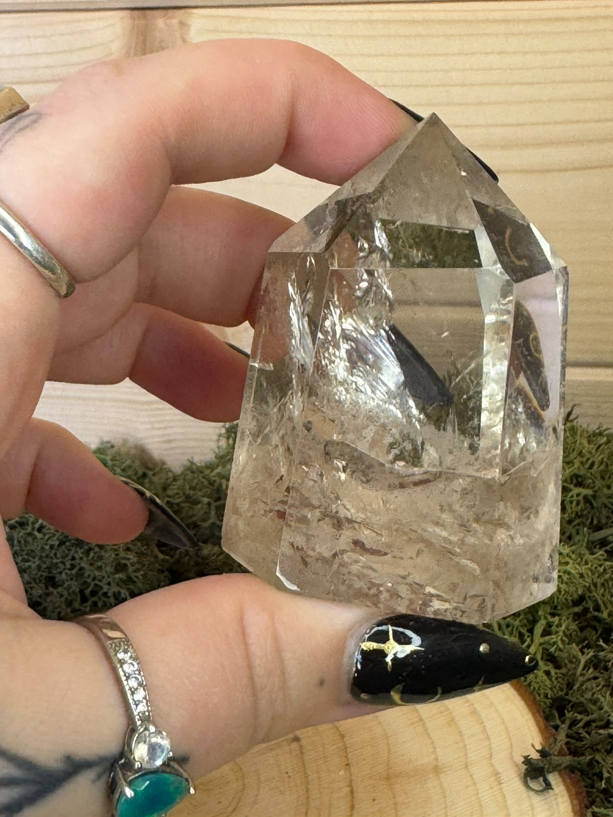 Handheld Smoky Quartz tower showing natural clarity internal veils and inclusions