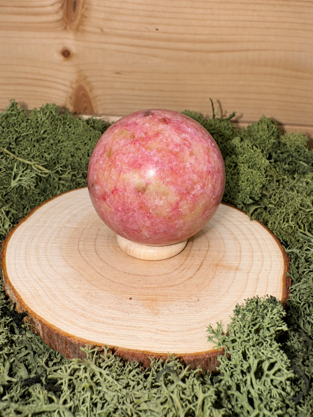 198g polished Thulite crystal sphere with vibrant pink red and pale green natural patterning