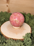 198g polished Thulite crystal sphere with vibrant pink red and pale green natural patterning